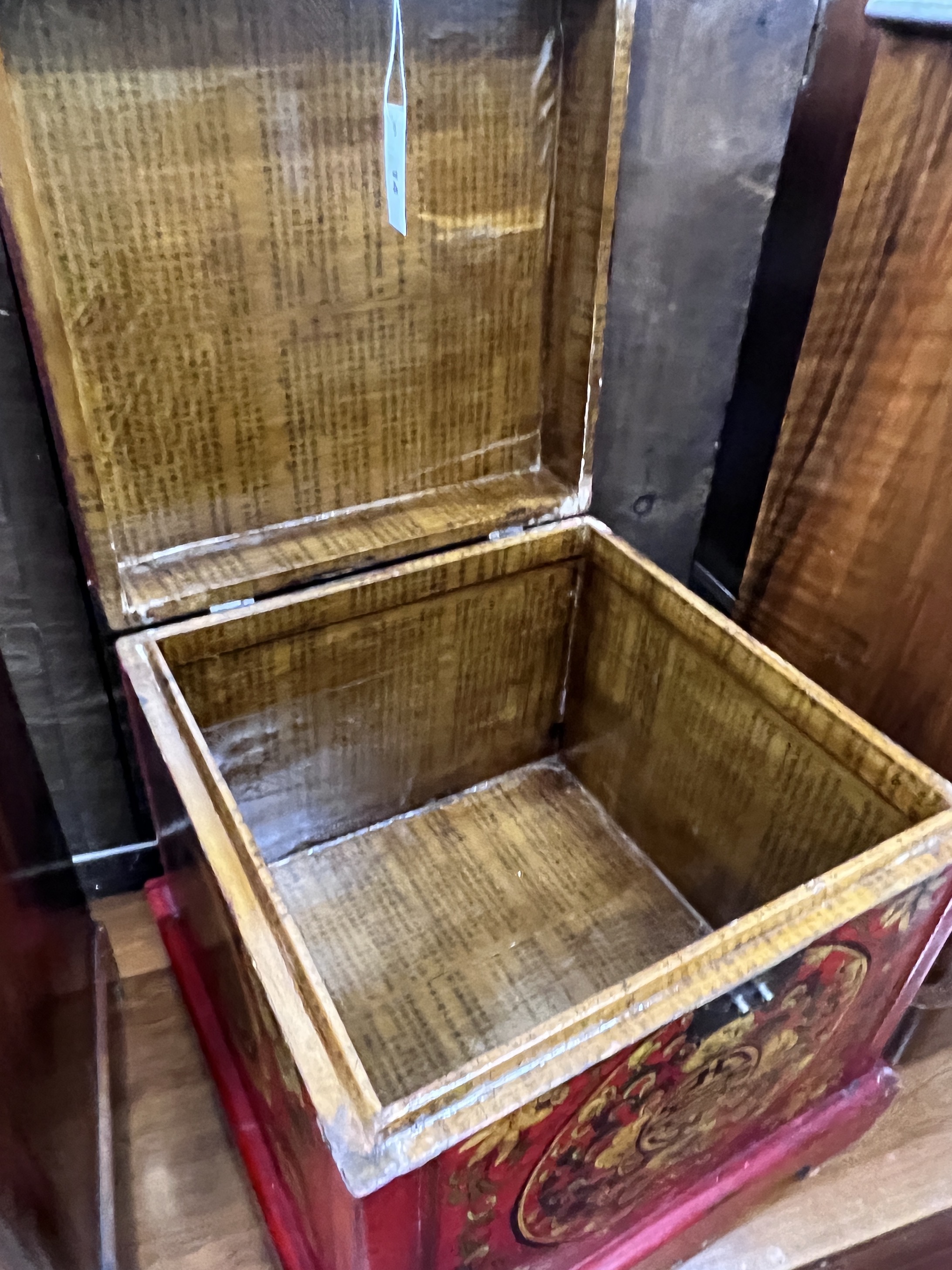 A modern Chinese red lacquer square painted trunk, 47cm, height 44cm